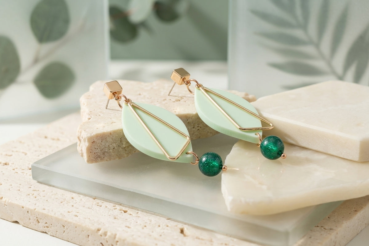 Green Ada geometric acrylic statement earrings in a styled product setting