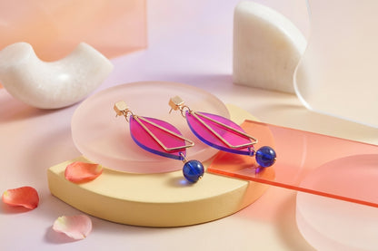 HB Ada geometric acrylic statement earrings in a styled product setting