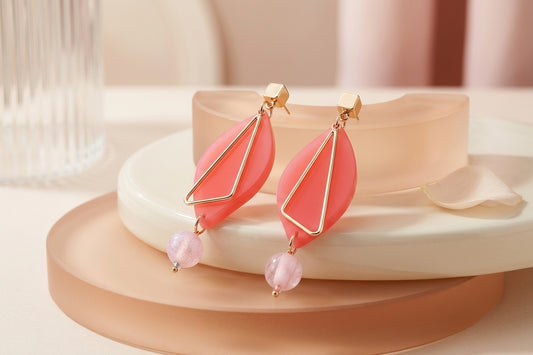 Pink Ada geometric acrylic statement earrings in a styled product setting