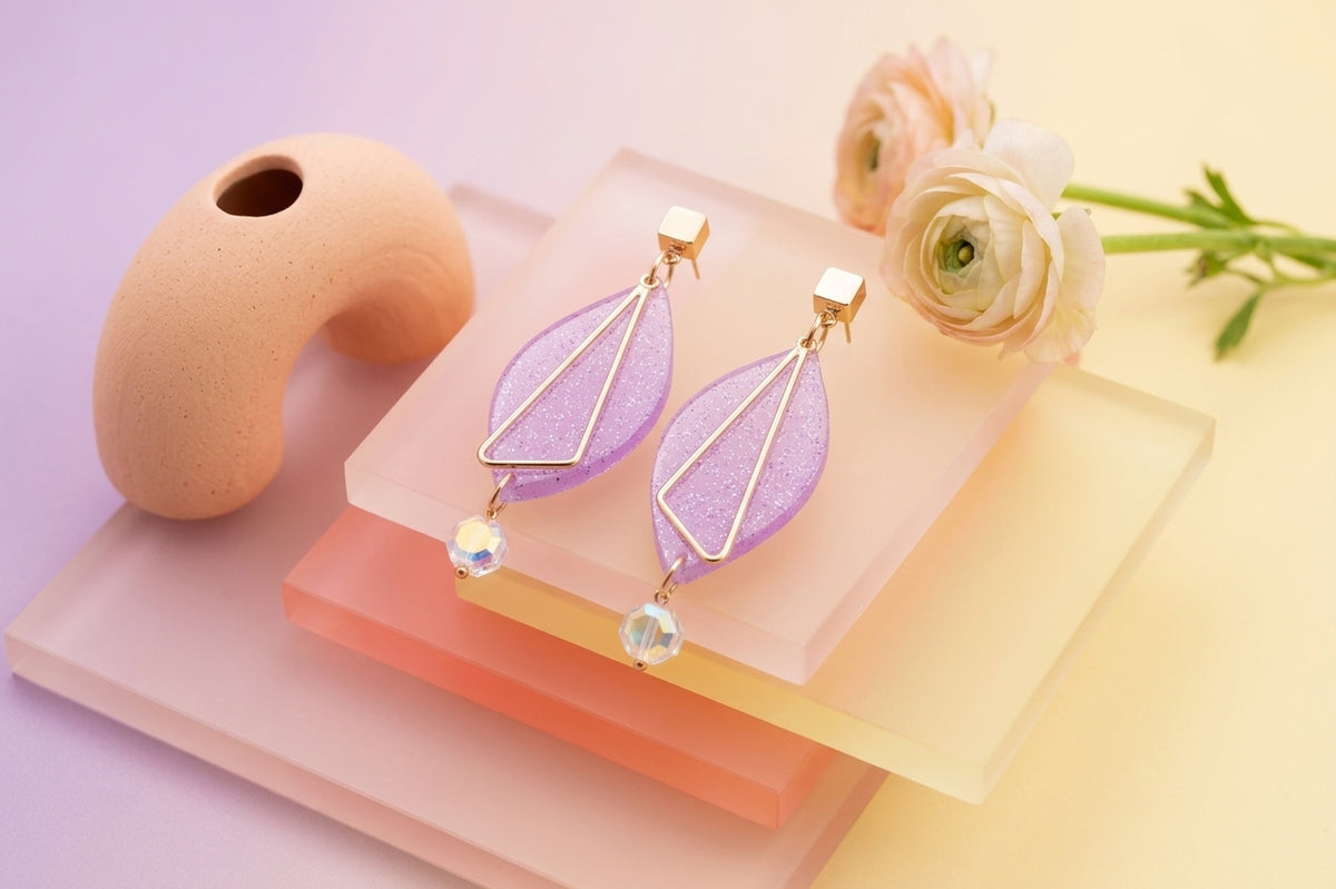 Purple Ada geometric acrylic statement earrings in a styled product setting