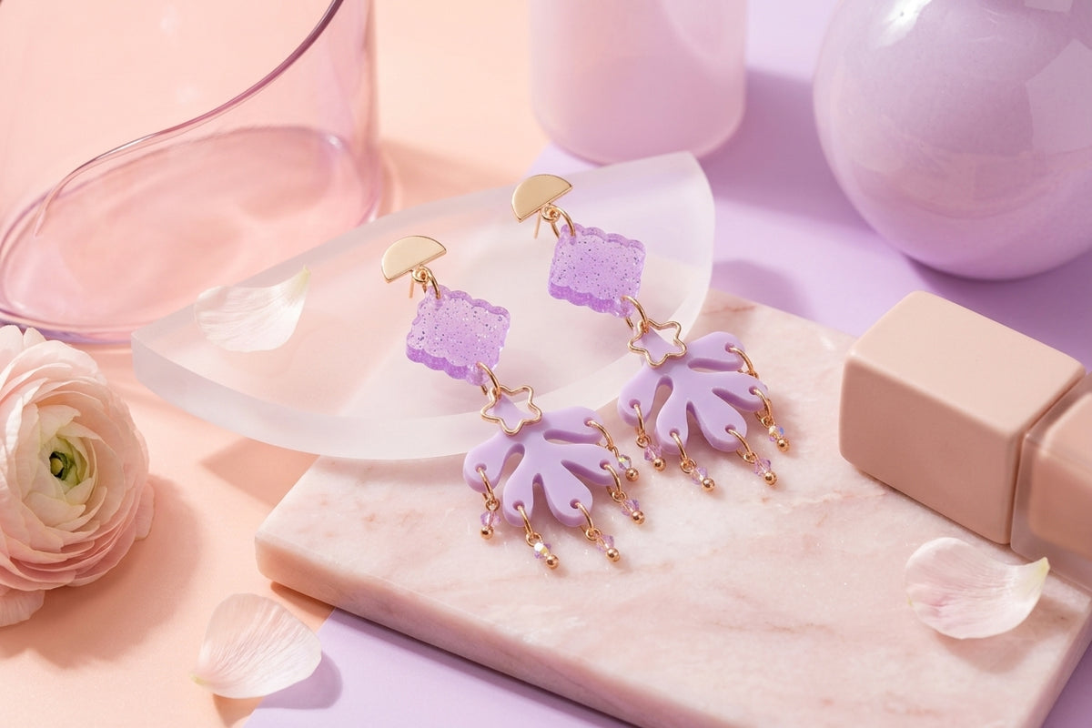 Purple Alba acrylic statement dangle earrings in a styled product setting