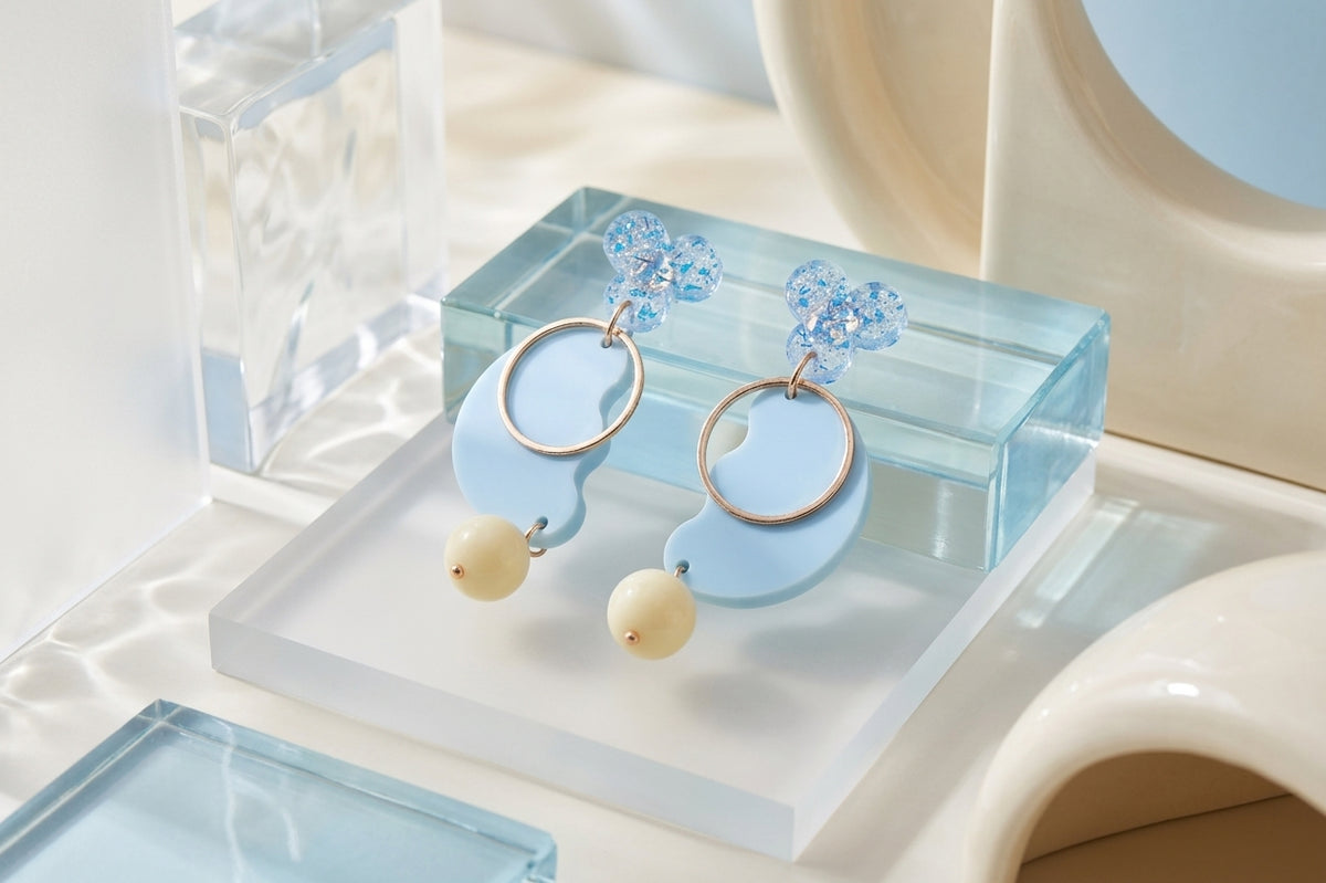 Blue Ayla modern acrylic statement earrings in a styled product setting