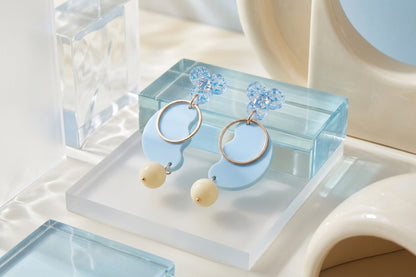 Blue Ayla modern acrylic statement earrings in a styled product setting
