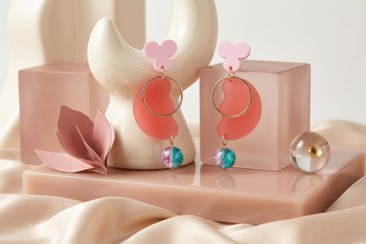 Pink Ayla modern acrylic statement earrings in a styled product setting