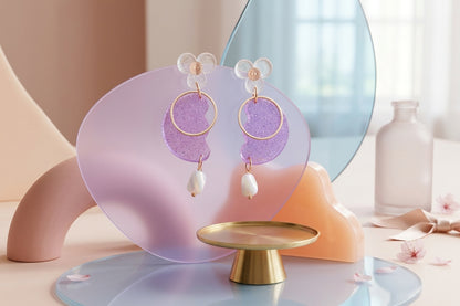 Purple Ayla modern acrylic statement earrings in a styled product setting