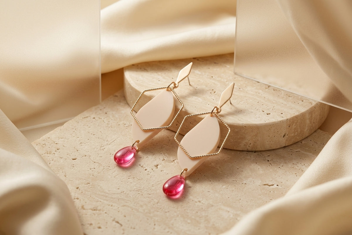 Beige Elise long heart dangle earrings in a styled product setting