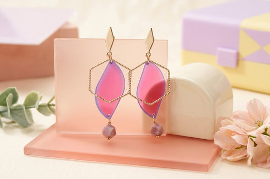 HB Elise long heart dangle earrings in a styled product setting
