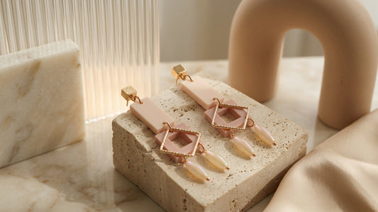 Beige Ella geometric rectangle drop earrings in a styled product setting