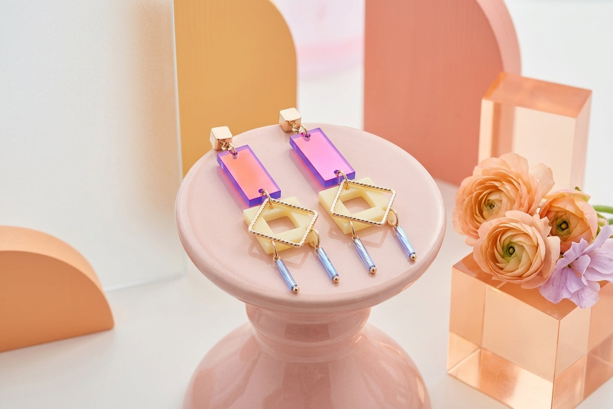 HB Ella geometric rectangle drop earrings in a styled product setting