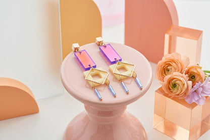 HB Ella geometric rectangle drop earrings in a styled product setting