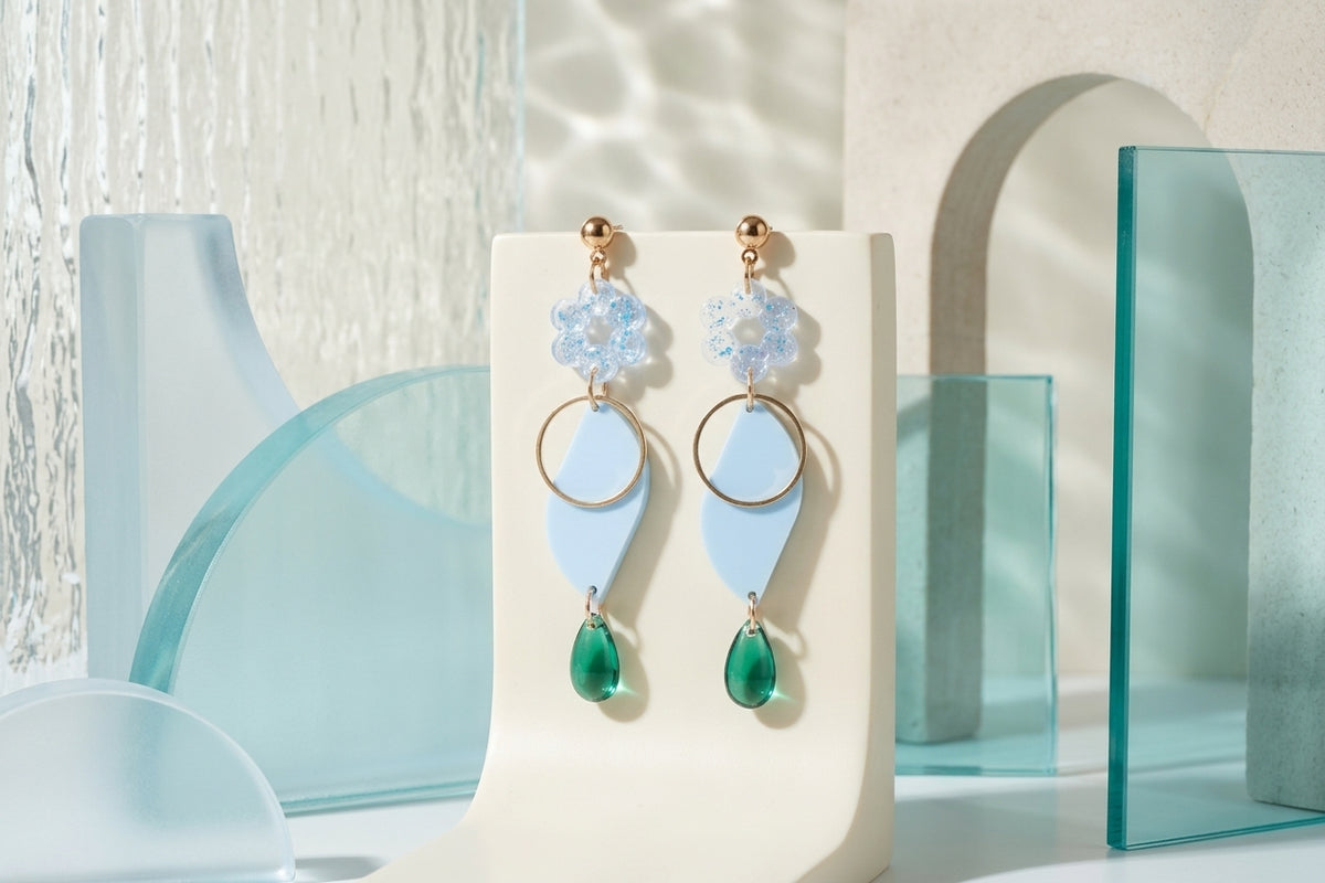 Blue Elsa floral long dangle earrings in a styled product setting