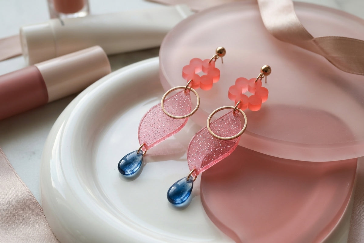 Pink Elsa floral long dangle earrings in a styled product setting
