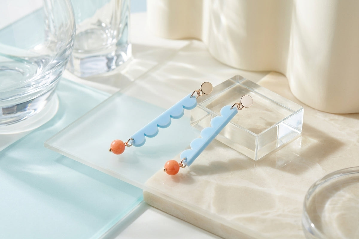 Blue Emma long geometric acrylic earrings in a styled product setting