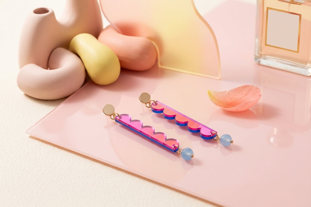 HB Emma long geometric acrylic earrings in a styled product setting