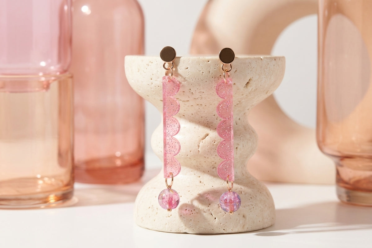 Pink Emma long geometric acrylic earrings in a styled product setting