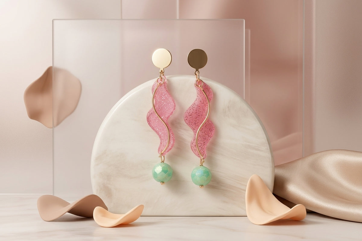 Pink Esme long acrylic statement earrings in a styled product setting