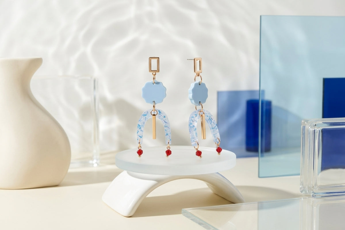 Blue Eva geometric beaded drop earrings in a styled product setting