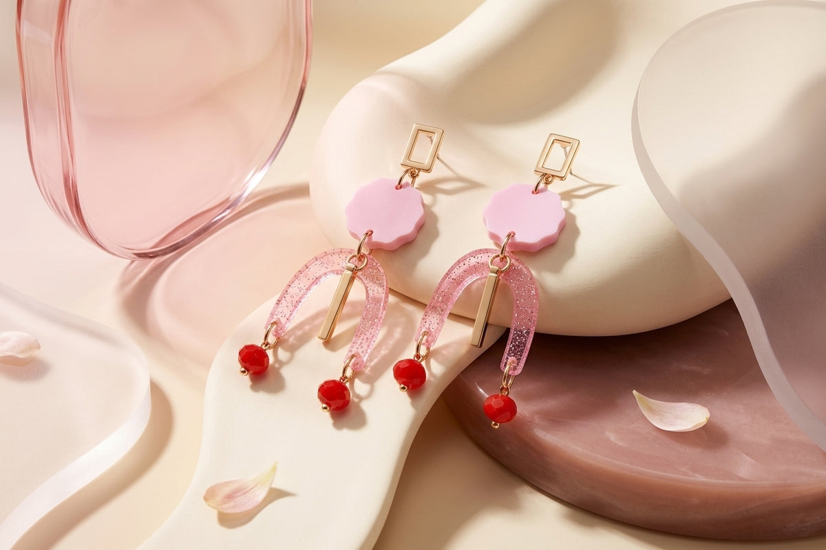 Pink Eva geometric beaded drop earrings in a styled product setting
