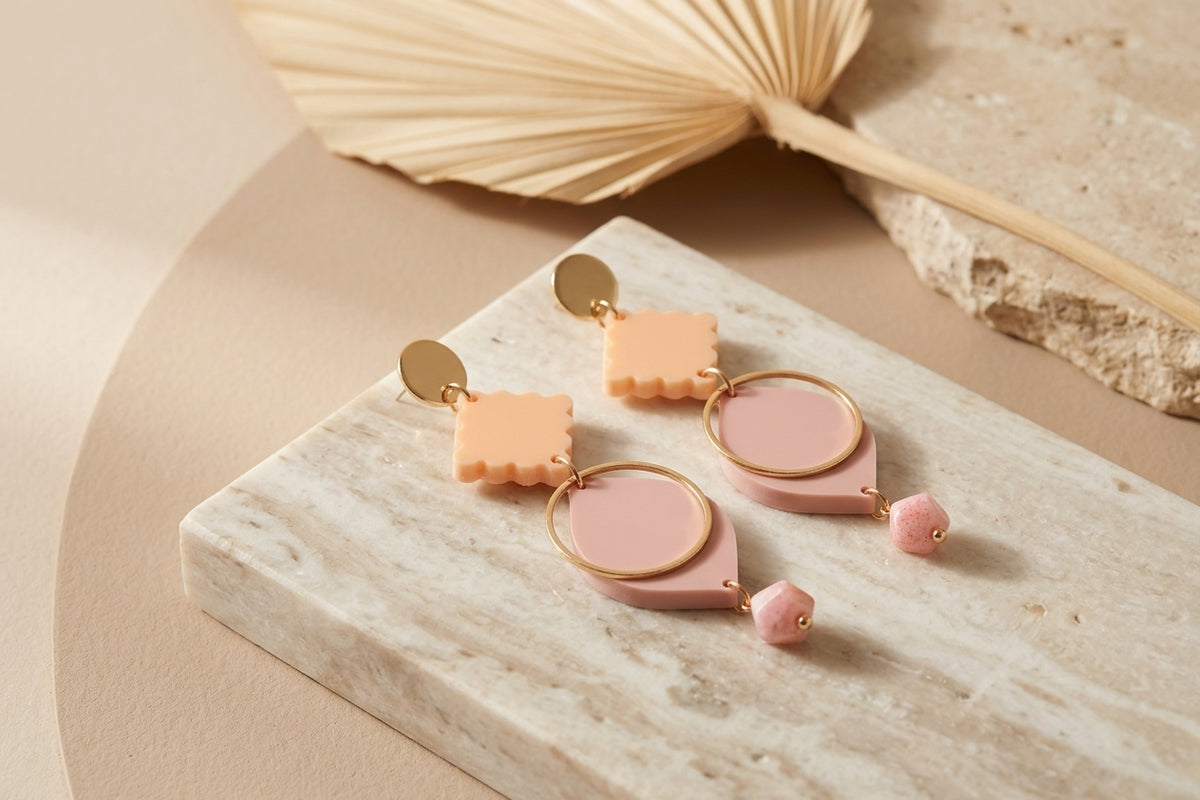 Beige Fien long geometric drop earrings in a styled product setting