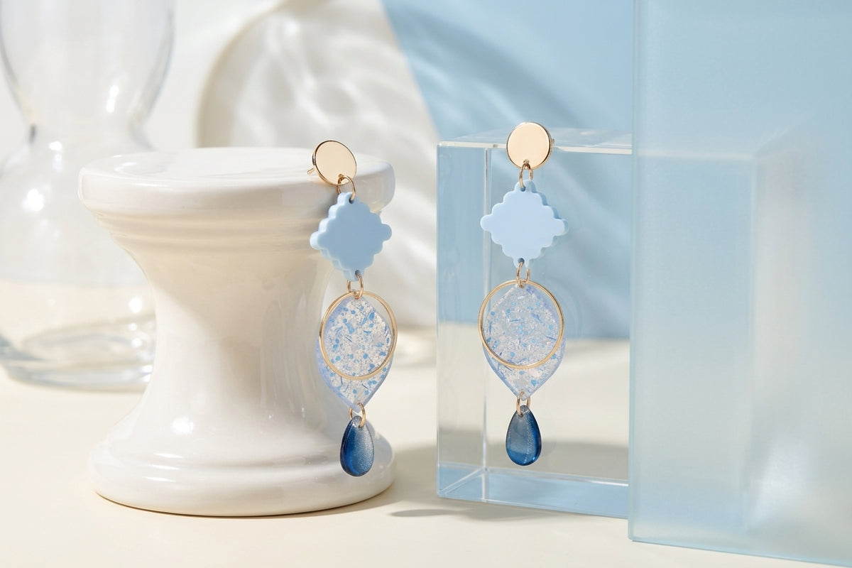 Blue Fien long geometric drop earrings in a styled product setting