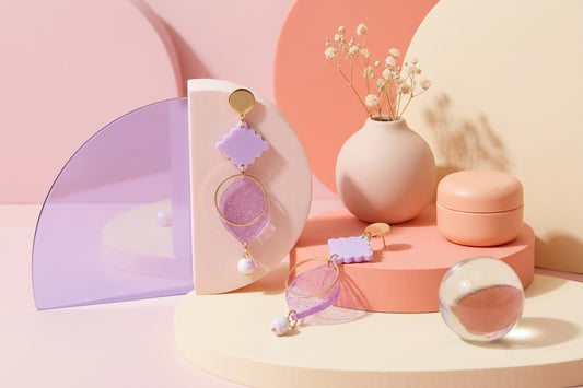 Purple Fien long geometric drop earrings in a styled product setting