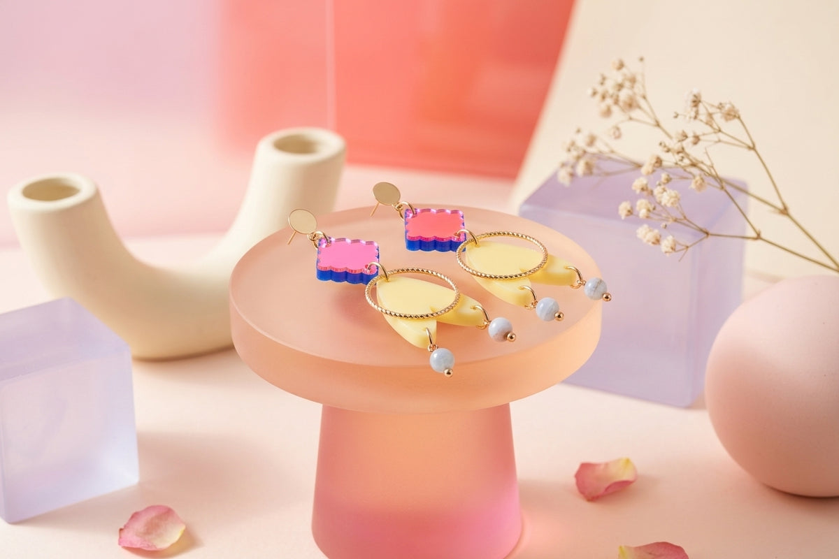 HB Fleur geometric acrylic statement earrings in a styled product setting