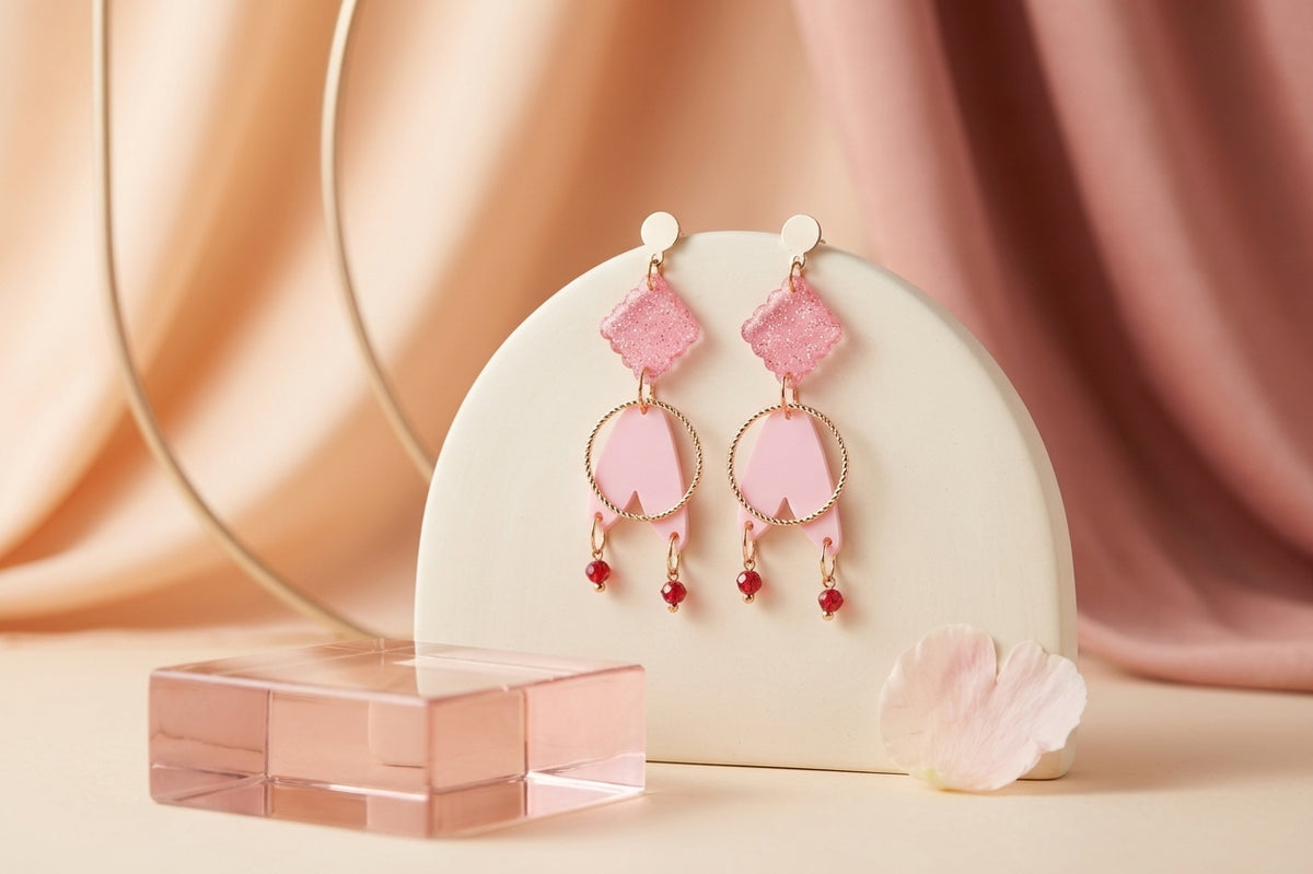 Pink Fleur geometric acrylic statement earrings in a styled product setting
