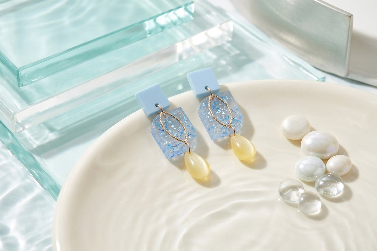 Blue Freya small geometric dangle earrings in a styled product setting