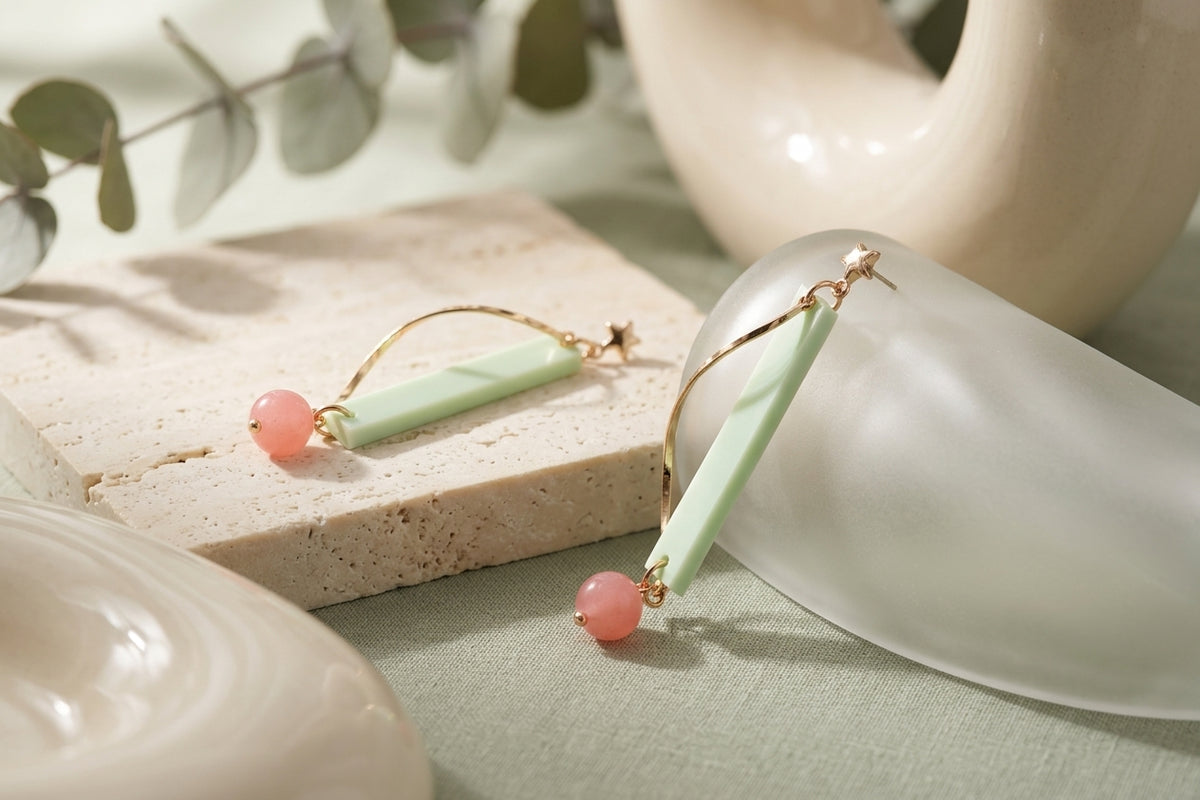 Green Ina long rectangle acrylic earrings in a styled product setting