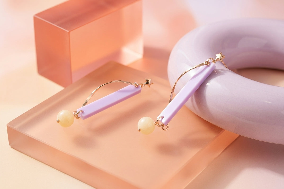 Purple Ina long rectangle acrylic earrings in a styled product setting