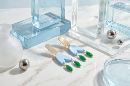 Blue Iris geometric long drop earrings in a styled product setting