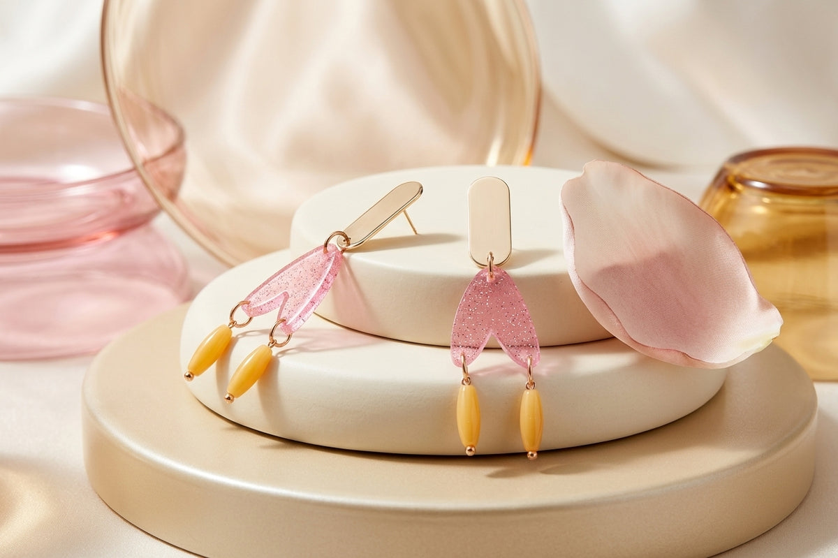 Pink Iris geometric long drop earrings in a styled product setting