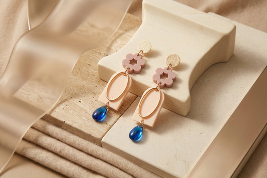 Beige Lena floral long drop earrings in a styled product setting