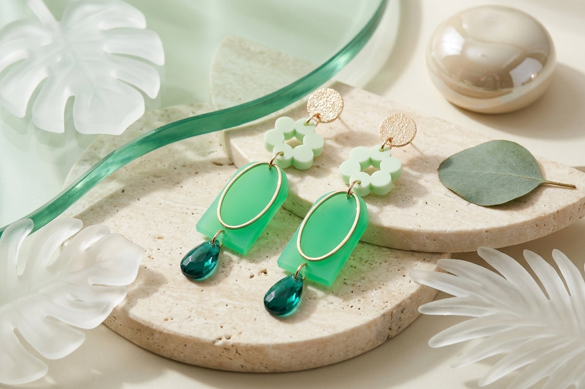 Green Lena floral long drop earrings in a styled product setting