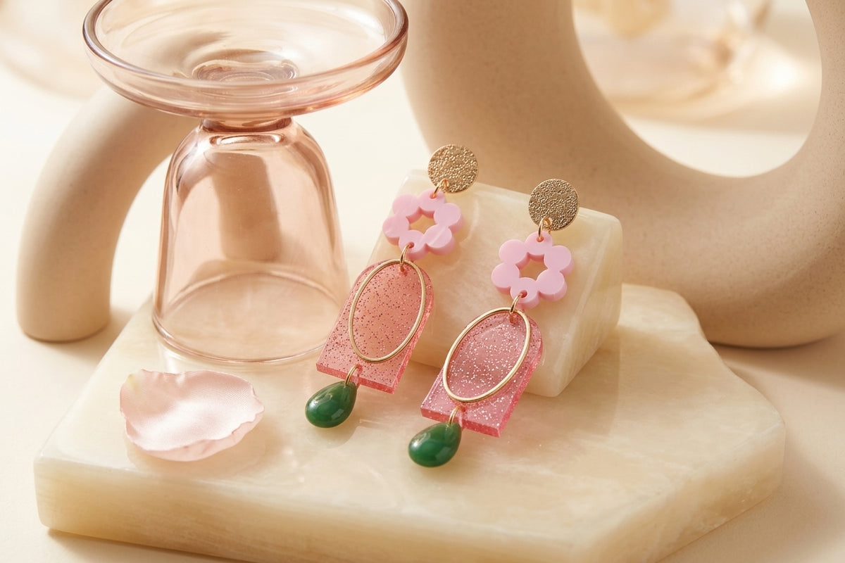 Pink Lena floral long drop earrings in a styled product setting