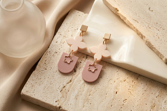 Beige Lia floral heart drop earrings in a styled product setting