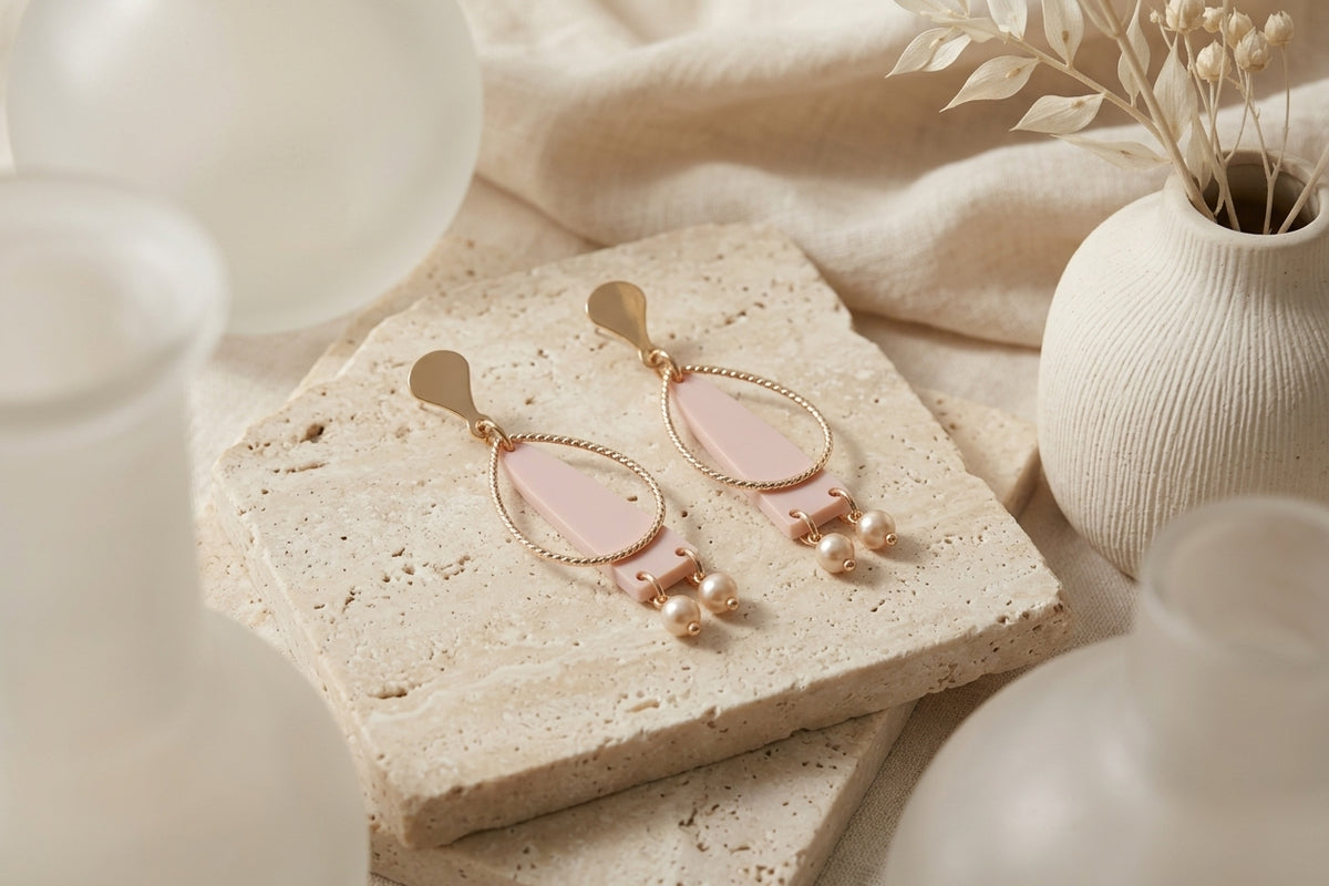Beige Lina long geometric acrylic earrings in a styled product setting