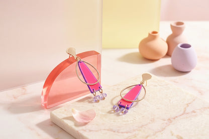 HB Lina long geometric acrylic earrings in a styled product setting