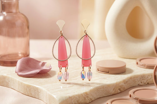 Pink Lina long geometric acrylic earrings in a styled product setting