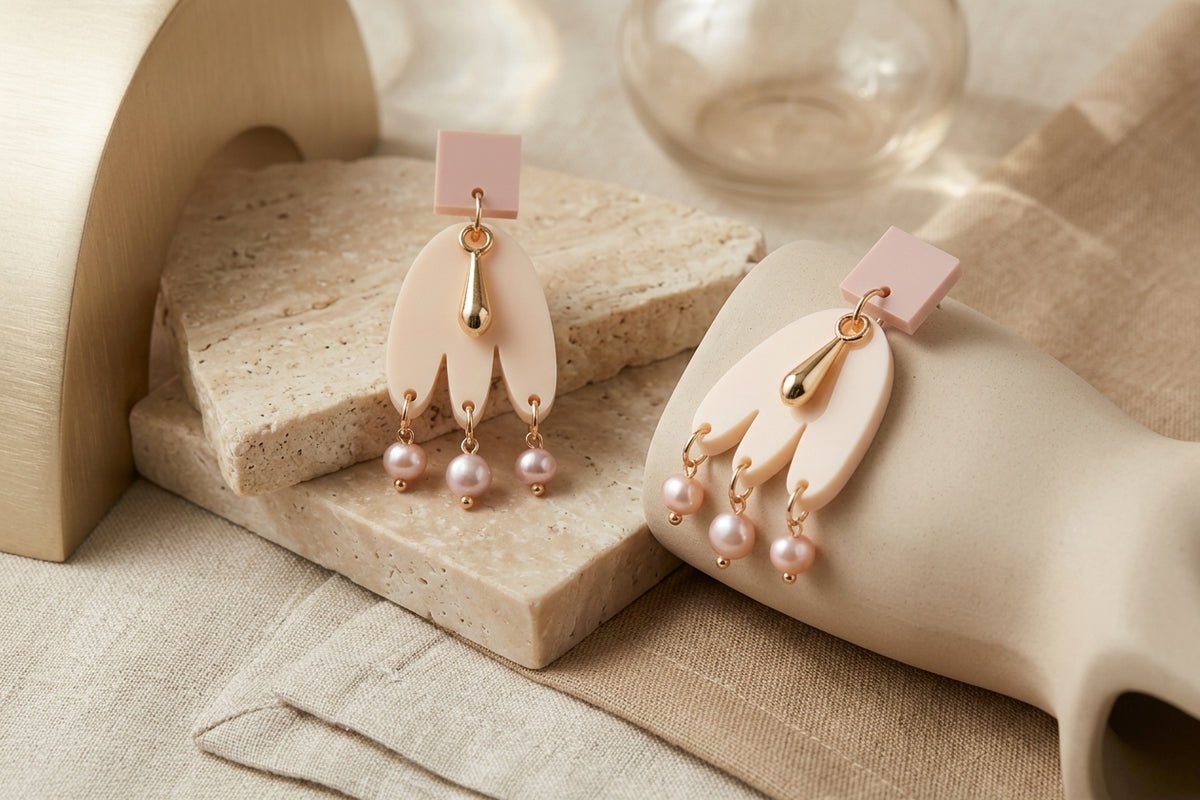 Beige Liv acrylic beaded statement earrings in a styled product setting