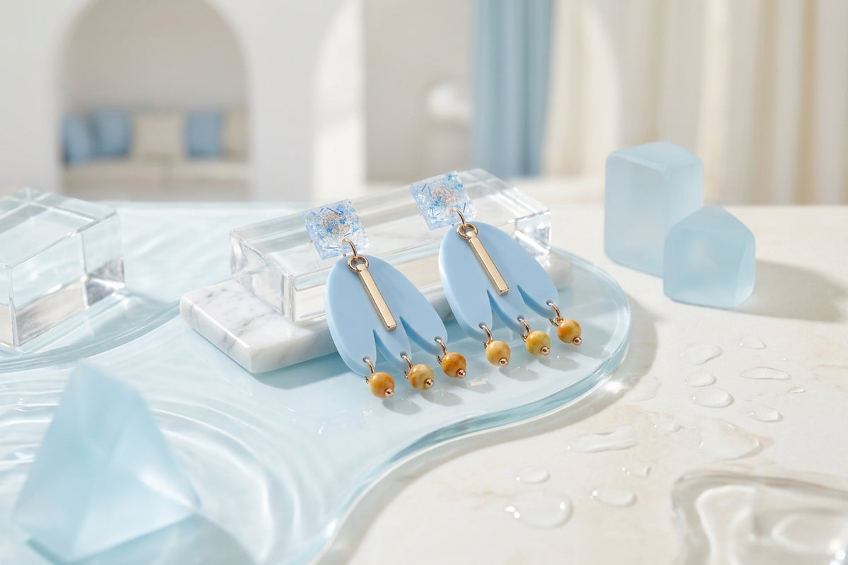 Blue Liv acrylic beaded statement earrings in a styled product setting