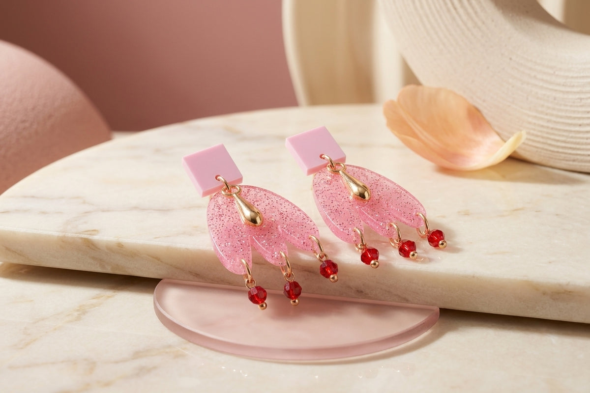 Pink Liv acrylic beaded statement earrings in a styled product setting