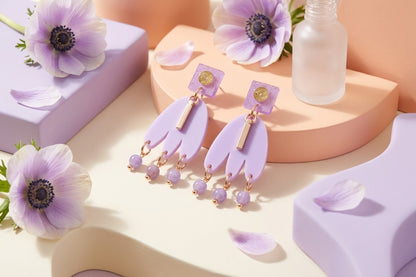 Purple Liv acrylic beaded statement earrings in a styled product setting