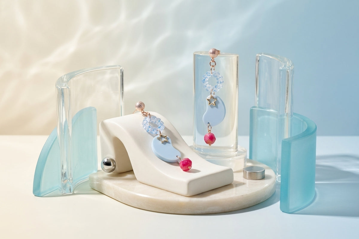 Blue Lucia floral star dangle earrings in a styled product setting