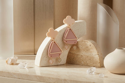 Beige Maud flower statement earrings in a styled product setting