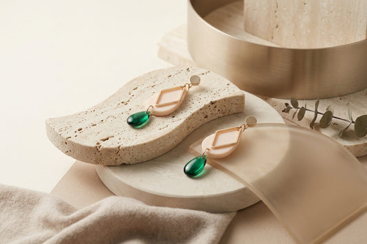 Beige Mia geometric teardrop earrings in a styled product setting