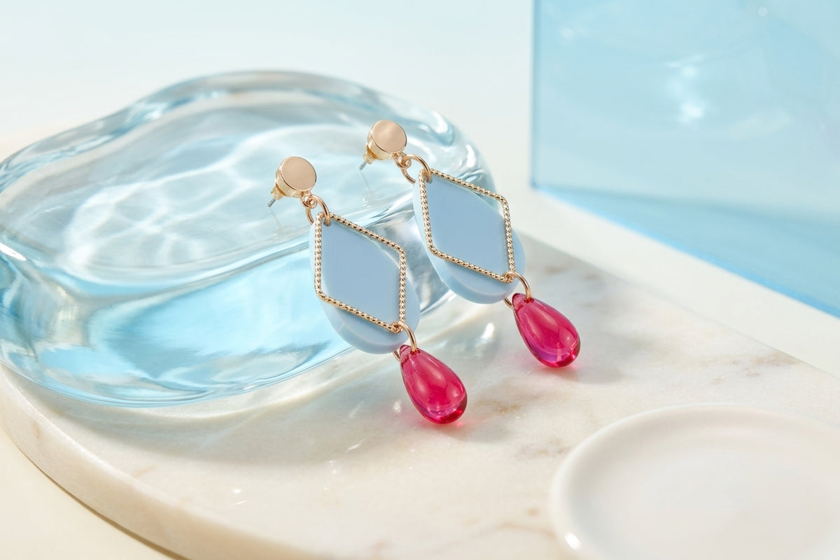 Blue Mia geometric teardrop earrings in a styled product setting