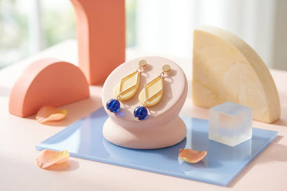 HB Mia geometric teardrop earrings in a styled product setting