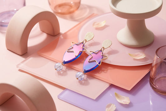 HB Nina star geometric dangle earrings in a styled product setting