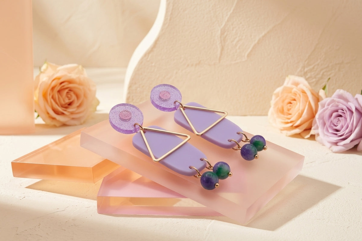Purple Nora geometric rectangle dangle earrings in a styled product setting